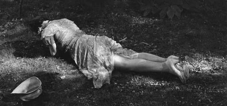 woman lying on ground
